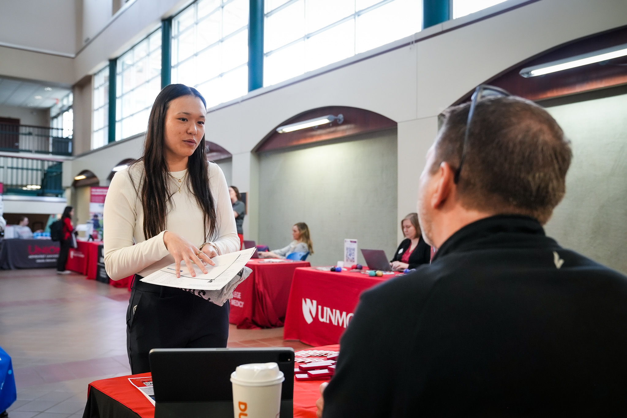 Doane student meets with a vendor at the Health and Medical Professions Expo