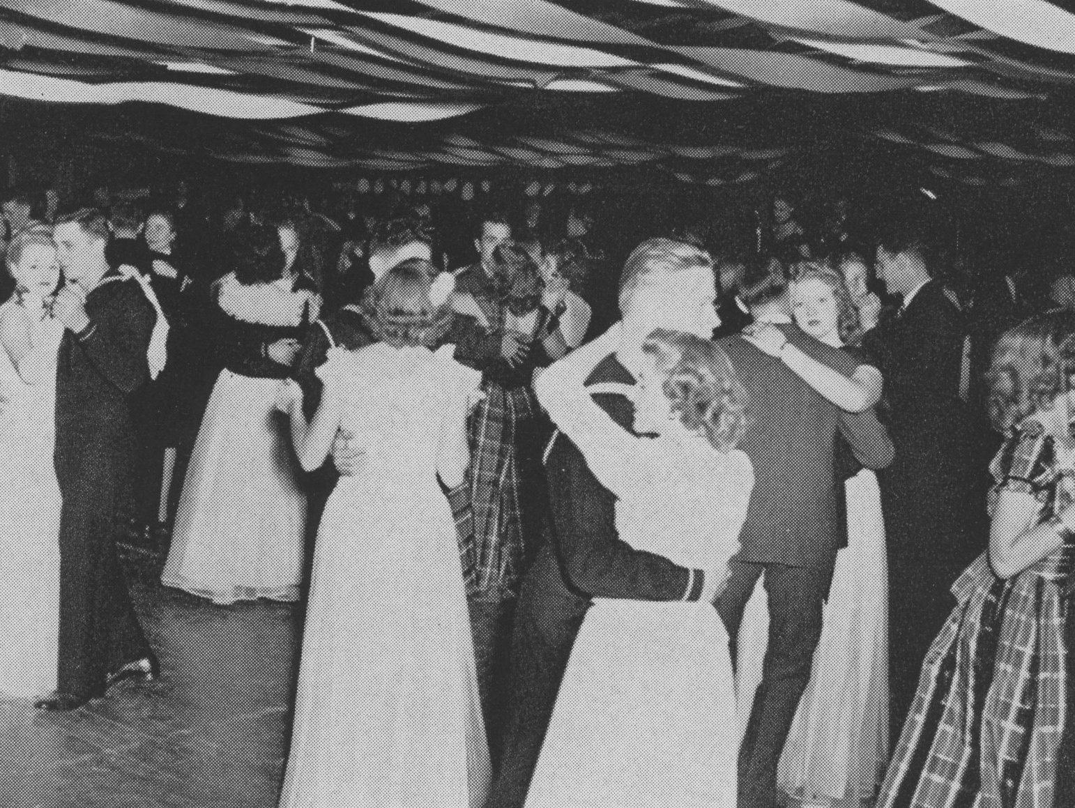Sailors and their dates dance to the music of Bob Decker and his orchestra at the Navy Ball in 1945