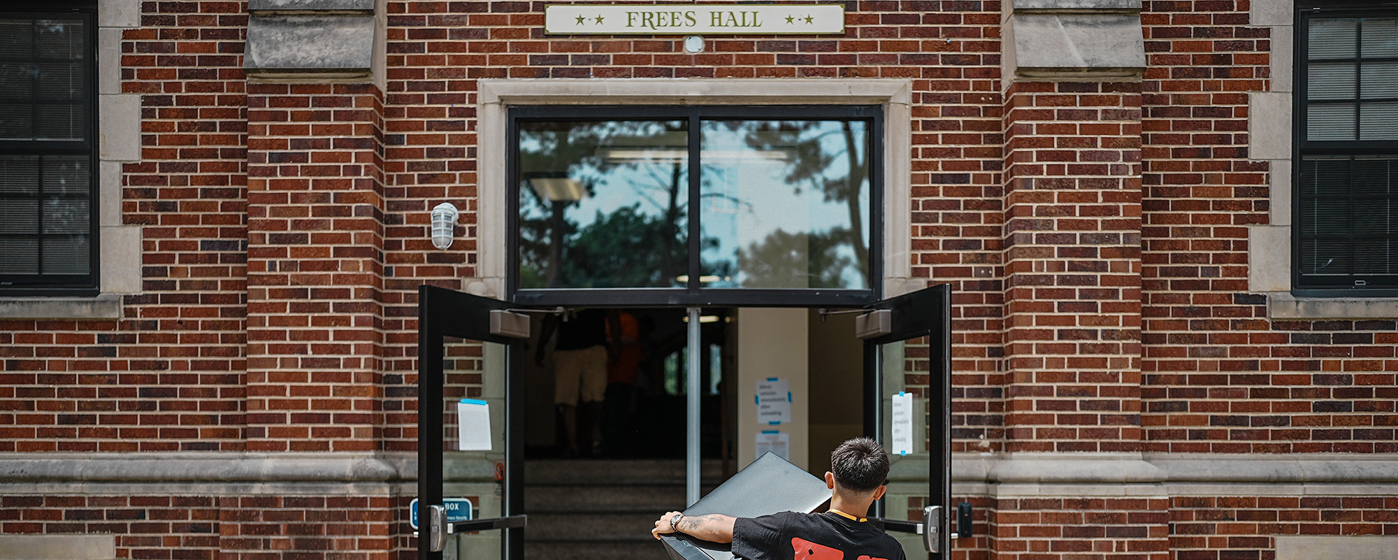 A student moving into Fees Hall