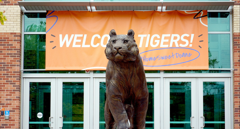 The doane tiger statue in front of Haddix auditorium