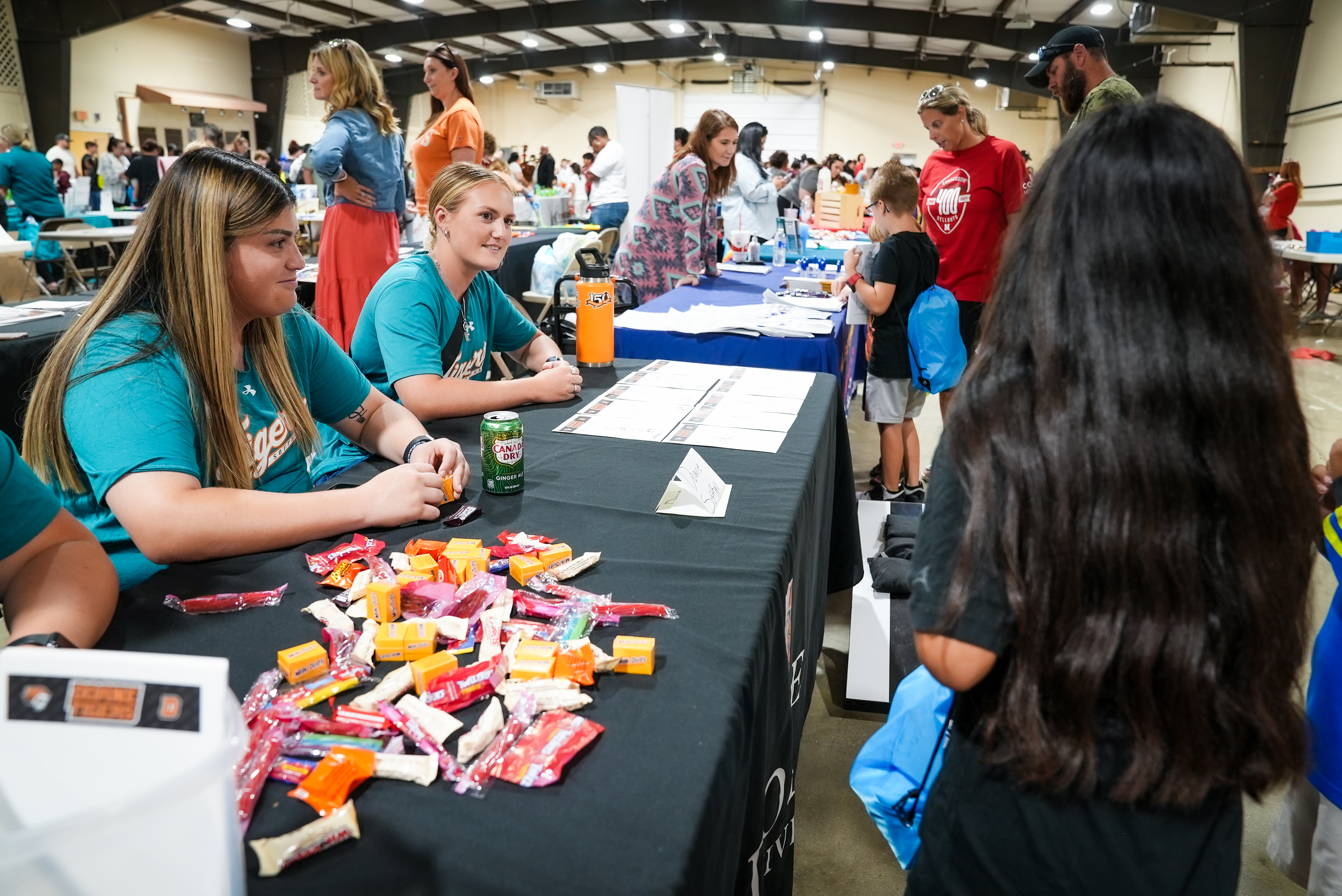 students manage a booth at the Celebrate Crete event