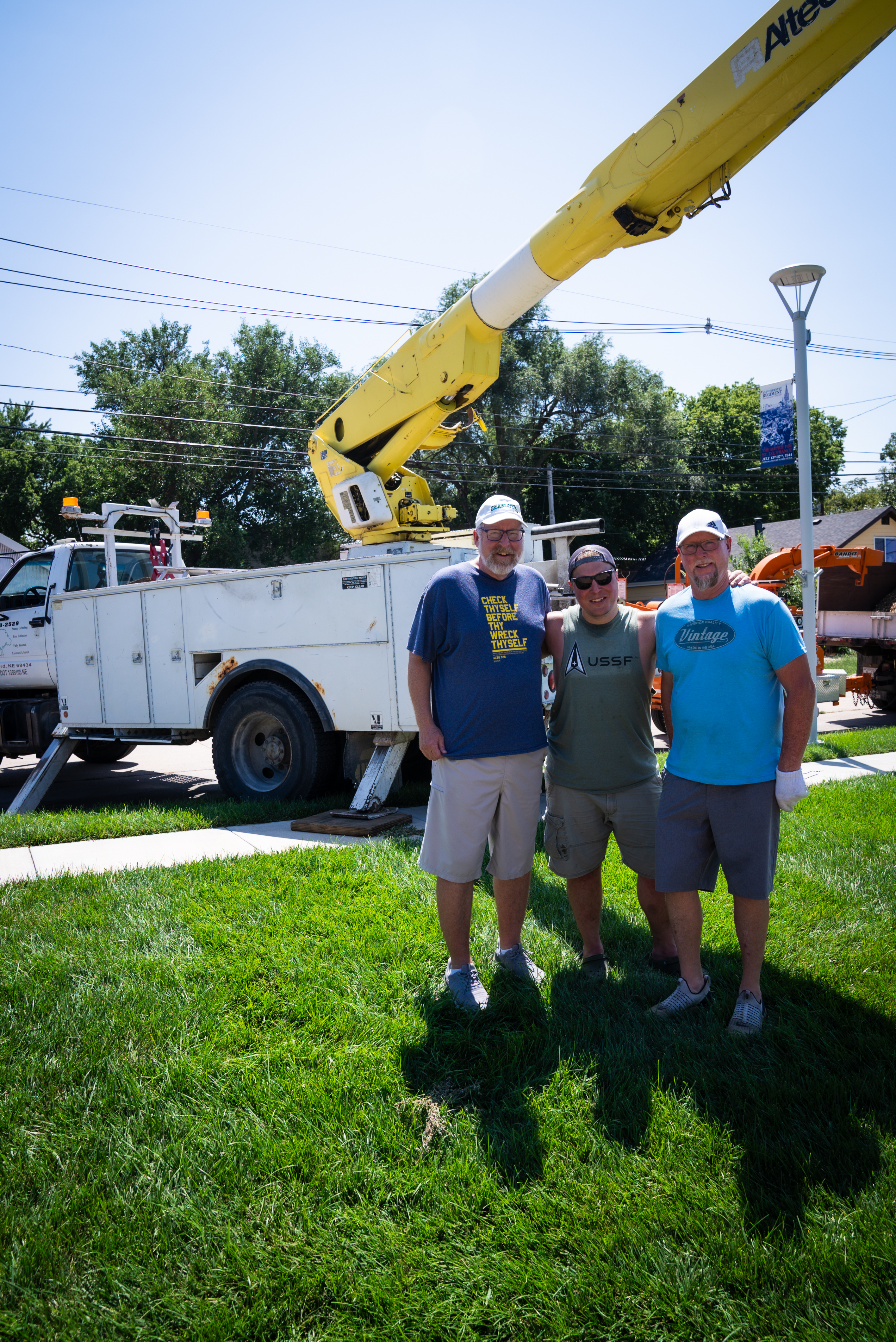 Daniel Dibbern stands with two volunteers