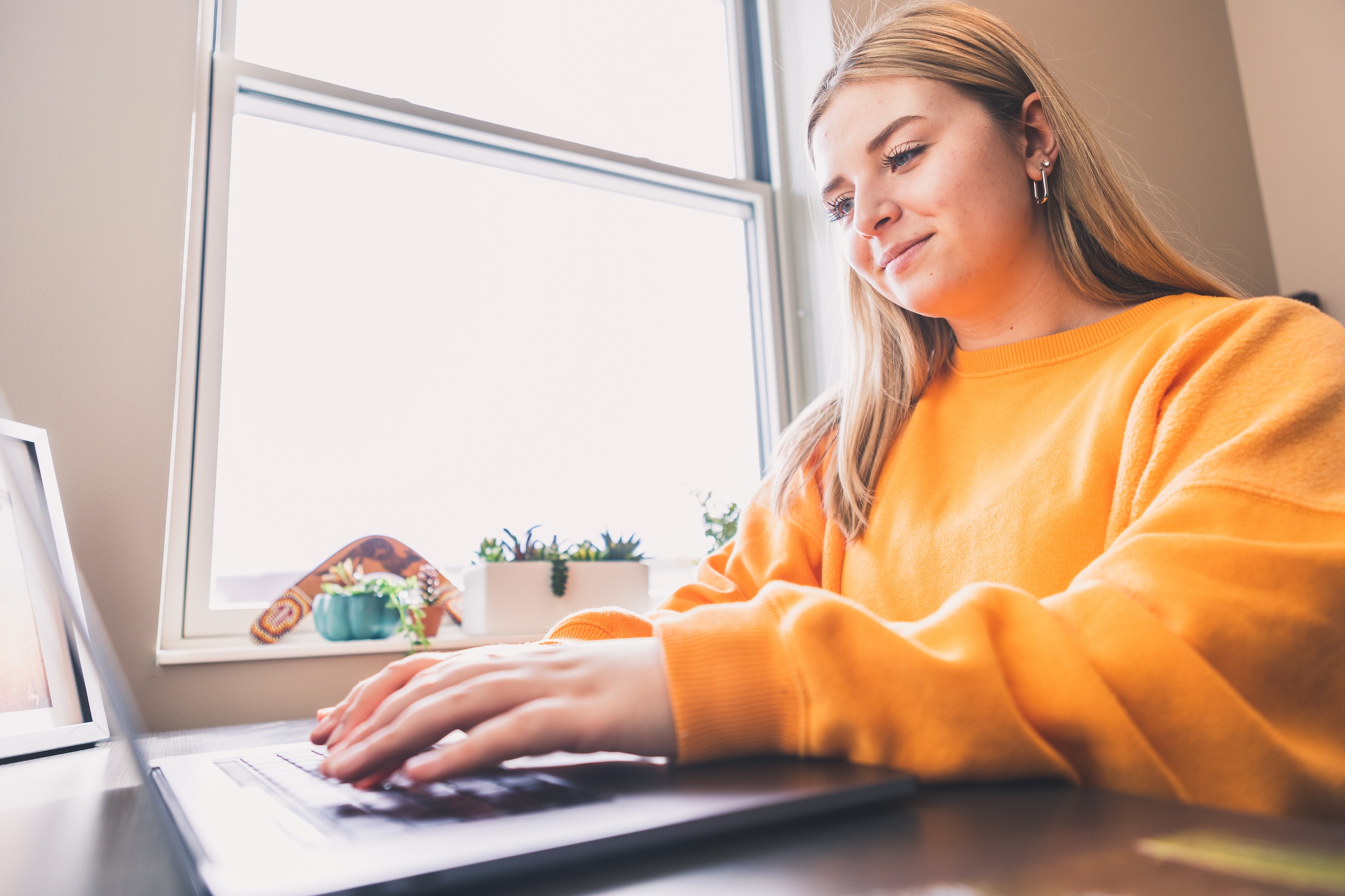 Girl typing on laptop