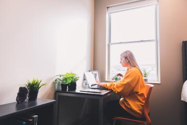 A Doane student studying in Doane Hall.