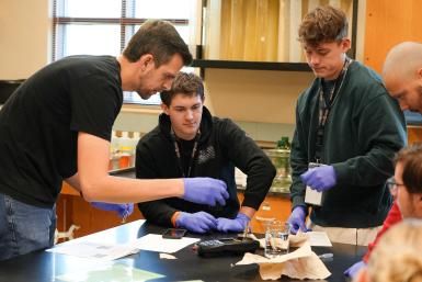 Chris Huber helps students test well water